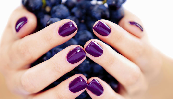 Polished Mobile Nails - purple nails holding grapes