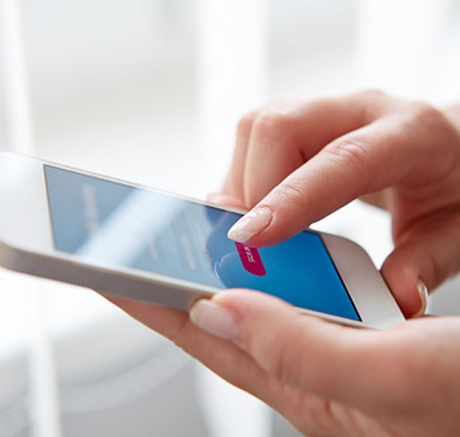 Polished Mobile Nails - female hand with manicured nails making a phone call